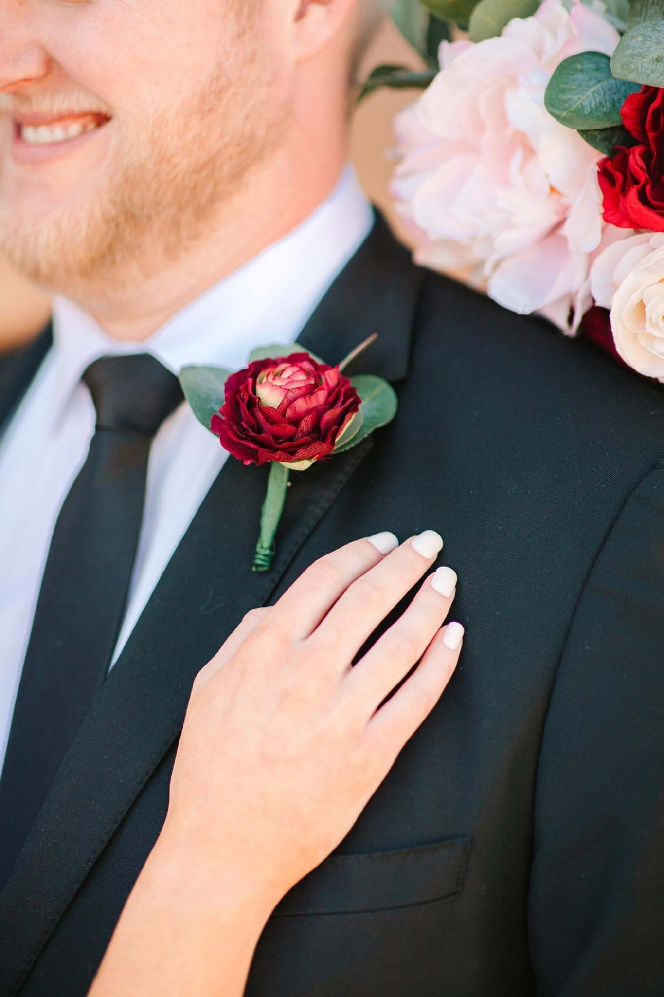 Picture of Stella Boutonniere (Burgundy Ranunculus)